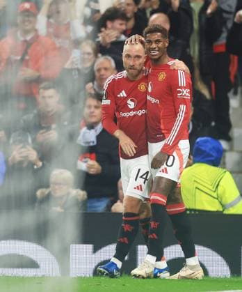 Christian Eriksen of Manchester United, ManU celebrates scoring the opening goal with Marcus Rashford Manchester United v FC Twente, UEFA Europa League, Group Stage, Football, Old Trafford, Manchester, UK, 25 Sep 2024 EDITORIAL USE ONLY No use with unauthorised audio, video, data, fixture lists, club league logos or live services. Online in-match use limited to 120 images, no video emulation. No use in betting, games or single club league player publications.  Copyright: xMattxWest Shutterstockx 14735174ag