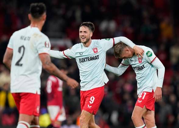 Manchester, England, 25th September 2024. Twente s Ricky van Wolfswinkel and Twente™s Gijs Besselink celebrate the draw during the UEFA Europa League match at Old Trafford, Manchester. Picture credit should read: Andrew Yates Sportimage EDITORIAL USE ONLY. No use with unauthorised audio, video, data, fixture lists, club league logos or live services. Online in-match use limited to 120 images, no video emulation. No use in betting, games or single club league player publications. SPI-3332-0067