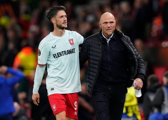 Manchester, England, 25th September 2024. Twente s Ricky van Wolfswinkel celebrates with Twente s head coach Joseph Oosting during the UEFA Europa League match at Old Trafford, Manchester. Picture credit should read: Andrew Yates Sportimage EDITORIAL USE ONLY. No use with unauthorised audio, video, data, fixture lists, club league logos or live services. Online in-match use limited to 120 images, no video emulation. No use in betting, games or single club league player publications. SPI-3332-0073