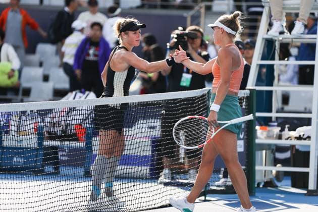 BEIJING, CHINA - SEPTEMBER 25: Yuliia Starodubtseva of Ukraine (R) high-five with Laura Siegemund of Germany in the Women s Singles Round of 128 match on day three of 2024 China Open at National Tennis Center on September 25, 2024 in Beijing, China.  Copyright: xVCGx 111520141073