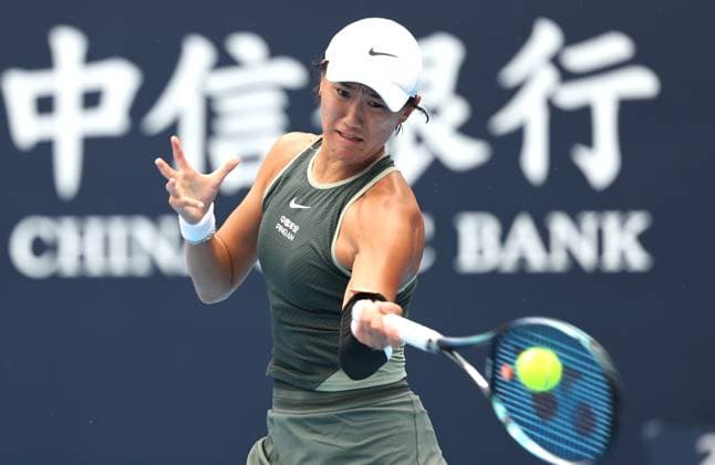 (240926) -- BEIJING, Sept. 26, 2024 -- Wang Xiyu of China hits a return during the women s singles first round match against Viktorija Golubic of Switzerland at 2024 China Open tennis tournament in Beijing, China, Sept. 26, 2024. ) (SP)CHINA-BEIJING-TENNIS-CHINA OPEN-WOMEN S SINGLES-FIRST ROUND (CN) ZhangxChen 