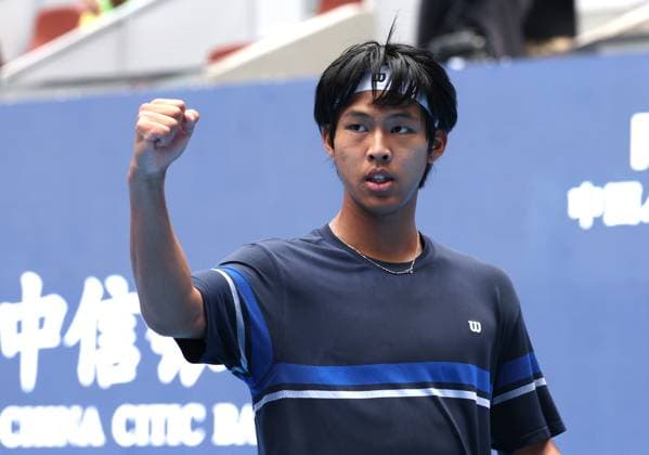 (240926) -- BEIJING, Sept. 26, 2024 -- Zhou Yi of China celebrates scoring during the men s singles first round match against Pavel Kotov of Russia at 2024 China Open tennis tournament in Beijing, China, Sept. 26, 2024. ) (SP)CHINA-BEIJING-TENNIS-CHINA OPEN-MEN S SINGLES-FIRST ROUND (CN) ZhangxChen 