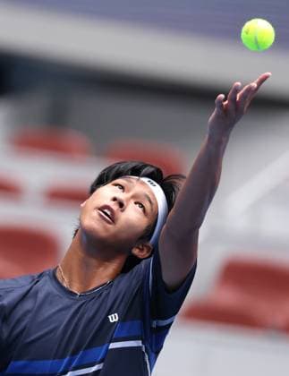 (240926) -- BEIJING, Sept. 26, 2024 -- Zhou Yi of China serves during the men s singles first round match against Pavel Kotov of Russia at 2024 China Open tennis tournament in Beijing, China, Sept. 26, 2024. ) (SP)CHINA-BEIJING-TENNIS-CHINA OPEN-MEN S SINGLES-FIRST ROUND (CN) ZhangxChen 
