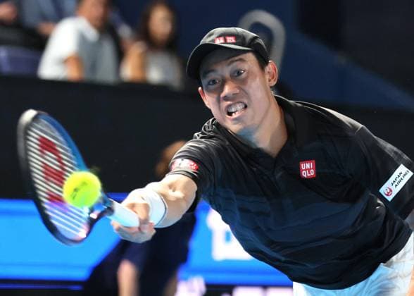 September 26, 2024, Tokyo, Japan - Japan s Kei Nishikori retuens the ball against Marin Cilic of Croatia at the first round match of the Japan Open Tennis championships at the Ariake Colosseum in Tokyo on Thursday, September 26, 2024. (photo by Yoshio Tsunoda AFLO) Noxthirdxpartyxsales  (0764908369st)
