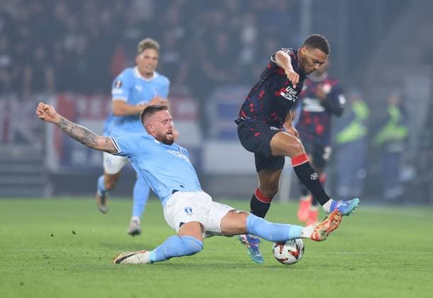 Cyriel Dessers of Rangers competes for the ball with Pontus Jansson of Malmo Malmo v Rangers, UEFA Europa League, Group Stage, Football, Eleda Stadion, Malmo, Sweden, 26 Sep 2024 EDITORIAL USE ONLY No use with unauthorised audio, video, data, fixture lists, club league logos or live services. Online in-match use limited to 120 images, no video emulation. No use in betting, games or single club league player publications.  Copyright: xMichaelxZemanek Shutterstockx 14739047w