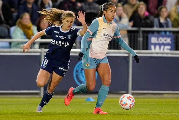 Manchester, England, 26th September 2024. Mary Fowler of Manchester City (R) is challenged by Celina Ould Hocine of Paris FC during the UEFA Womens Champions League match at the Academy Stadium, Manchester. Picture credit should read: Andrew Yates Sportimage EDITORIAL USE ONLY. No use with unauthorised audio, video, data, fixture lists, club league logos or live services. Online in-match use limited to 120 images, no video emulation. No use in betting, games or single club league player publications. SPI-3335-0018