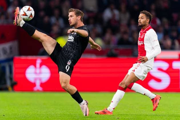 2024-09-26 AFC Ajax v Besiktas JK - UEFA Europa League 2024 25 League Phase MD1 AMSTERDAM, NETHERLANDS - SEPTEMBER 26: Semih Kilicsoy of Besiktas JK battles for the ball with Devyne Rensch of AFC Ajax during the UEFA Europa League 2024 25 League Phase MD1 match between AFC Ajax and Besiktas JK at Johan Cruijff Arena on September 26, 2024 in Amsterdam, Netherlands. (Photo by Joris Verwijst BSR Agency) Amsterdam Netherlands Content not available for redistribution in The Netherlands directly or indirectly through any third parties. Copyright: xBSRxAgencyx