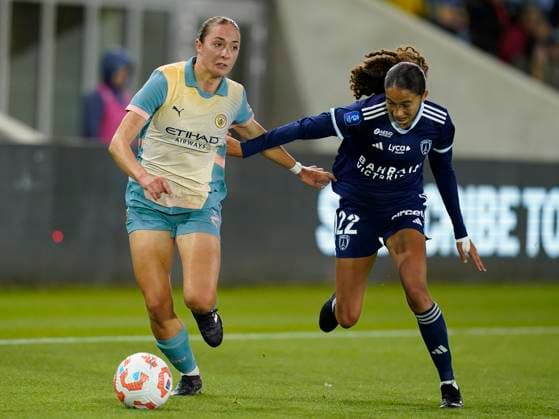 Manchester, England, 26th September 2024. Naomi Layzell of Manchester City (L) is challenged by Kessya Bussy of Paris FC during the UEFA Womens Champions League match at the Academy Stadium, Manchester. Picture credit should read: Andrew Yates Sportimage EDITORIAL USE ONLY. No use with unauthorised audio, video, data, fixture lists, club league logos or live services. Online in-match use limited to 120 images, no video emulation. No use in betting, games or single club league player publications. SPI-3335-0066