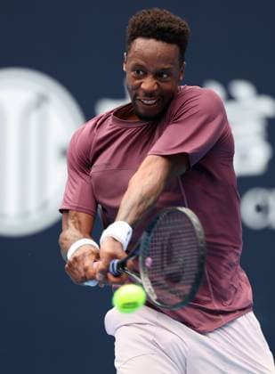 (240927) -- BEIJING, Sept. 27, 2024 -- Gael Monfils hits a return during the men s singles first round match between Daniil Medvedev of Russia and Gael Monfils of France at 2024 China Open tennis tournament in Beijing, capital of China, Sept. 27, 2024. ) (SP)CHINA-BEIJING-TENNIS-CHINA OPEN-MEN S SINGLES-FIRST ROUND (CN) ZhangxChenlin 
