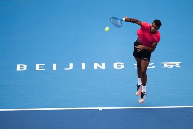(240927) -- BEIJING, Sept. 27, 2024 -- Giovanni Mpetshi Perricard hits a return during the men s singles first round match between Carlos Alcaraz of Spain and Giovanni Mpetshi Perricard of France at 2024 China Open tennis tournament in Beijing, capital of China, Sept. 27, 2024. ) (SP)CHINA-BEIJING-TENNIS-CHINA OPEN-MEN S SINGLES-FIRST ROUND (CN) ZhangxLong 