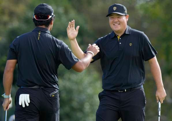September 27, 2024, Montreal, Pq, Canada: International team member Sungjae Im of South Korea, right, celebrates a birdie with partner International team Hideki Matsuyama of Japan, on the 7th hole during second round foursome match at the Presidents Cup golf tournament at Royal Montreal Golf Club in Montreal, Friday, Sept. 27, 2024. Golf 2024: Presidents Cup: Round Two - ZUMAc35_ 20240927_zaf_c35_035 Copyright: xFrankxGunnx