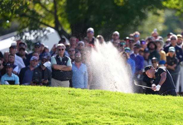 September 27, 2024, Montreal, Pq, Canada: International team member Si Woo Kim of South Korea, hits out of the bunker on the 3rd hole during the second round foursome match at the Presidents Cup golf tournament at Royal Montreal Golf Club in Montreal, Friday, Sept. 27, 2024. Golf 2024: Presidents Cup: Round Two  - ZUMAc35_ 20240927_zaf_c35_041 Copyright: xNathanxDenettex