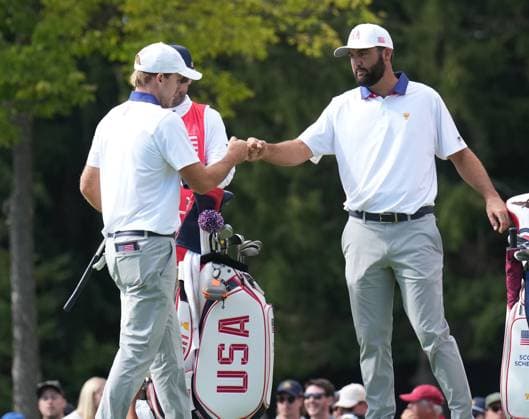 September 27, 2024, Montreal, Pq, Canada: United States team member Russell Henley and partner Scottie Scheffler fist bump after winning the third hole during second round foursome match at the Presidents Cup golf tournament at Royal Montreal Golf Club Friday, September 27, 2024 in Montreal. Golf 2024: Presidents Cup: Round Two  - ZUMAc35_ 20240927_zaf_c35_073 Copyright: xNathanxDenettex