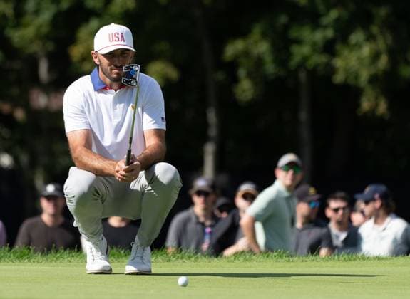 September 27, 2024, Montreal, Pq, CANADA: United States team member Max Homa lines his putt on the third hole of their second round foursome match at the Presidents Cup golf tournament at the Royal Montreal Golf Club, in Montreal, Friday, Sept. 27, 2024. Canada News - September 27, 2024  - ZUMAc35_ 20240927_zaf_c35_118 Copyright: xChristinnexMuschix