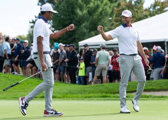 September 27, 2024, Montreal, Pq, CANADA: United States team member Tony Finau and partner Wyndham Clark fist bump on the sixth hole of their second round foursome match at the Presidents Cup golf tournament at the Royal Montreal Golf Club, in Montreal, Friday, Sept. 27, 2024. Canada News - September 27, 2024  - ZUMAc35_ 20240927_zaf_c35_129 Copyright: xChristinnexMuschix