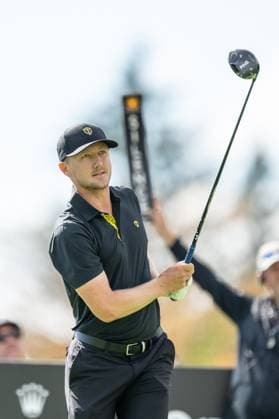 MONTREAL, QC - SEPTEMBER 27: International Team golfer Mackenzie Hughes plays his shot from the second tee at the 2024 Presidents Cup on September 27, 2024 at The Royal Montreal Golf Club in Montreal, QC (Photo by Vincent Ethier Icon Sportswire) GOLF: SEP 27 Presidents Cup EDITORIAL USE ONLY Icon2409271568