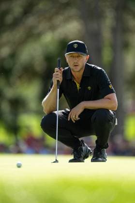 MONTREAL, QC - SEPTEMBER 27: International Team golfer Mackenzie Hughes on the second green at the 2024 Presidents Cup on September 27, 2024 at The Royal Montreal Golf Club in Montreal, QC (Photo by Vincent Ethier Icon Sportswire) GOLF: SEP 27 Presidents Cup EDITORIAL USE ONLY Icon2409271800