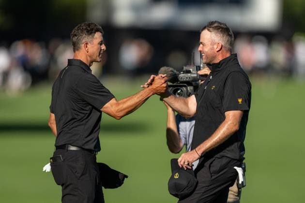 MONTREAL, QC - SEPTEMBER 27: International Team golfer Adam Scott and teammate Taylor Pendrith celebrate on the 14th green at the 2024 Presidents Cup on September 27, 2024 at The Royal Montreal Golf Club in Montreal, QC (Photo by Vincent Ethier Icon Sportswire) GOLF: SEP 27 Presidents Cup EDITORIAL USE ONLY Icon2409273720