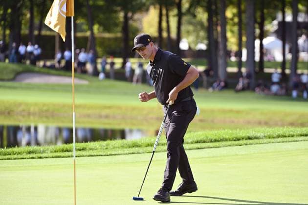 September 27, 2024, Montreal, Pq, Canada: International team member Adam Scott of Australia, makes a putt on the 10th green during a foursome match at the Presidents Cup golf tournament at the Royal Montreal Golf Club in Montreal, Friday, Sept. 27, 2024. Canada News - September 27, 2024  - ZUMAc35_ 20240927_zaf_c35_143 Copyright: xGrahamxHughesx