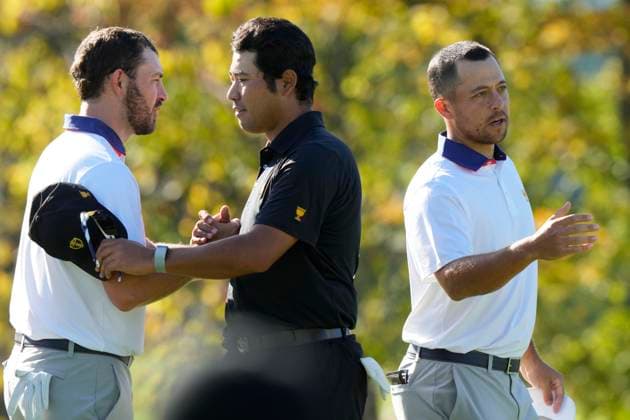 September 27, 2024, Montreal, Pq, Canada: International team member Hideki Matsuyama of Japan shakes hands with United States team members Russell Henley, left, and Xander Schauffele, right, after winning their second round foursome match 7&6 at the Presidents Cup golf tournament at Royal Montreal Golf Club Friday, September 27, 2024 in Montreal. Hideki Matsuyama, Russell Henley, Xander Schauffele, - ZUMAc35_ 20240927_zaf_c35_144 Copyright: xFrankxGunnx
