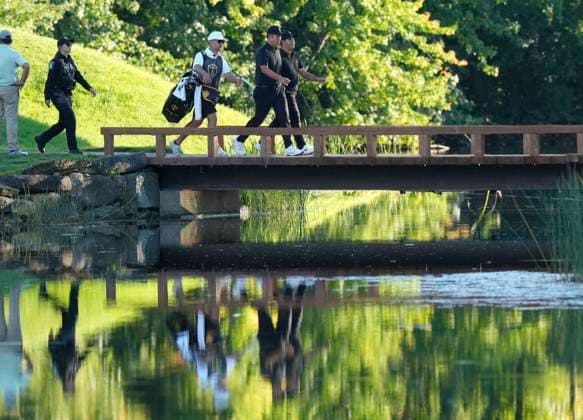 September 27, 2024, Montreal, Pq, Canada: International team member Si Woo Kim of South Korea, and International team member Byeong Hun An of South Korea, cross the bridge to the 16th hole during second round foursome play at the Presidents Cup golf tournament at Royal Montreal Golf Club Friday, September 27, 2024 in Montreal. Si Woo Kim, Byeong Hun An, - ZUMAc35_ 20240927_zaf_c35_191 Copyright: xFrankxGunnx