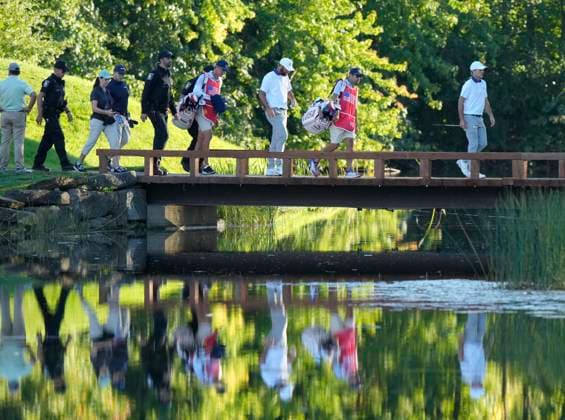 September 27, 2024, Montreal, Pq, Canada: United States team member Scottie Scheffler and United States team member Russell Henley cross the bridge to the 16th hole during second round foursome match at the Presidents Cup golf tournament at Royal Montreal Golf Club Friday, September 27, 2024 in Montreal. Scottie Scheffler, Russell Henley  - ZUMAc35_ 20240927_zaf_c35_192 Copyright: xFrankxGunnx