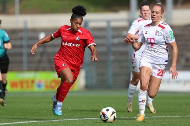 Shekiera Martinez SC Freiburg and Janina Hechler 1 FC Koeln in a duel during the Woman Bundesliga match between 1 FC Köln and SC Freiburg, Franz Kremer Stadion on September 28, 2024 in Cologne, Germany, Germany Photo by Oliver Kaelke DeFodi Images Shekiera Martinez SC Freiburg and Janina Hechler 1 FC Koeln battle for the ball during the Woman Bundesliga match between 1 FC Köln and SC Freiburg at Franz Kremer Stadion on September 28, 2024 in Köln, Germany Photo by Oliver Kaelke DeFodi Images DFL regulations prohibit any use of photographs as image sequences and or quasi video Defodi 003 678 2024 09 28 OK KOESCF 0171 Defodi-003 DFL regulations prohibit any use of photographs as image sequences and or quasi-video.