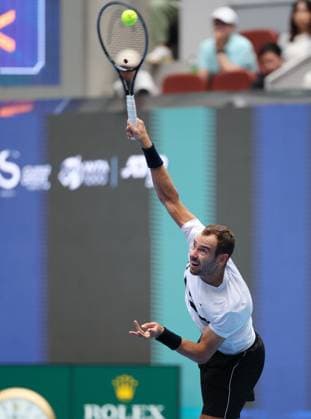 (240928) -- BEIJING, Sept. 28, 2024 -- Roman Safiullin serves during the men s singles second round match between Jannik Sinner of Italy and Roman Safiullin of Russia at 2024 China Open tennis tournament in Beijing, capital of China, Sept. 28, 2024. ) (SP)CHINA-BEIJING-TENNIS-CHINA OPEN-MEN S SINGLES (CN) ZhangxChenlin 