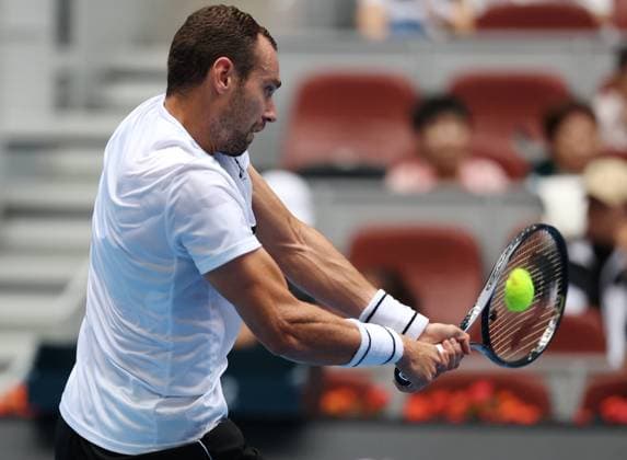 (240928) -- BEIJING, Sept. 28, 2024 -- Roman Safiullin hits a return during the men s singles second round match between Jannik Sinner of Italy and Roman Safiullin of Russia at 2024 China Open tennis tournament in Beijing, capital of China, Sept. 28, 2024. ) (SP)CHINA-BEIJING-TENNIS-CHINA OPEN-MEN S SINGLES (CN) ZhangxChenlin 