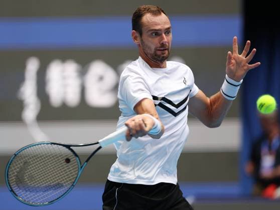 (240928) -- BEIJING, Sept. 28, 2024 -- Roman Safiullin hits a return during the men s singles second round match between Jannik Sinner of Italy and Roman Safiullin of Russia at 2024 China Open tennis tournament in Beijing, capital of China, Sept. 28, 2024. ) (SP)CHINA-BEIJING-TENNIS-CHINA OPEN-MEN S SINGLES (CN) ZhangxChenlin 
