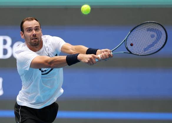 (240928) -- BEIJING, Sept. 28, 2024 -- Roman Safiullin hits a return during the men s singles second round match between Jannik Sinner of Italy and Roman Safiullin of Russia at 2024 China Open tennis tournament in Beijing, capital of China, Sept. 28, 2024. ) (SP)CHINA-BEIJING-TENNIS-CHINA OPEN-MEN S SINGLES (CN) ZhangxChenlin 