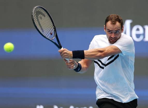 (240928) -- BEIJING, Sept. 28, 2024 -- Roman Safiullin hits a return during the men s singles second round match between Jannik Sinner of Italy and Roman Safiullin of Russia at 2024 China Open tennis tournament in Beijing, capital of China, Sept. 28, 2024. ) (SP)CHINA-BEIJING-TENNIS-CHINA OPEN-MEN S SINGLES (CN) ZhangxChenlin 