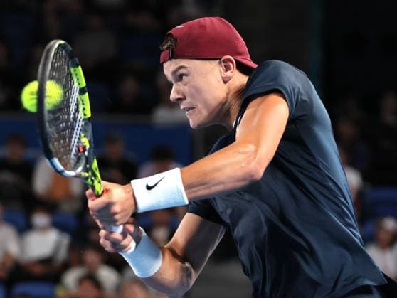 September 28, 2024, Tokyo, Japan - Holger Rune of Denmark retuens the ball against Yoshihito Nishioka of Japan at the second round match of the Japan Open Tennis championships at the Ariake Colosseum in Tokyo on Saturday, September 28, 2024. (photo by Yoshio Tsunoda AFLO) Noxthirdxpartyxsales  (0765382987st)