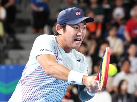 September 28, 2024, Tokyo, Japan - Japan s Yoshihito Nishioka retuens the ball against Holger Rune of Denmark at the second round match of the Japan Open Tennis championships at the Ariake Colosseum in Tokyo on Saturday, September 28, 2024. (photo by Yoshio Tsunoda AFLO) Noxthirdxpartyxsales  (0765383013st)