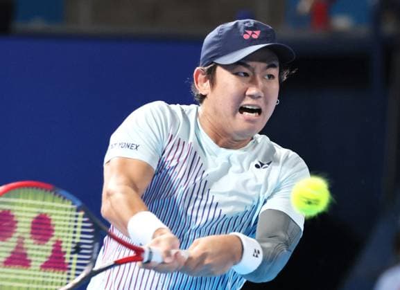September 28, 2024, Tokyo, Japan - Japan s Yoshihito Nishioka retuens the ball against Holger Rune of Denmark at the second round match of the Japan Open Tennis championships at the Ariake Colosseum in Tokyo on Saturday, September 28, 2024. (photo by Yoshio Tsunoda AFLO) Noxthirdxpartyxsales  (0765383025st)