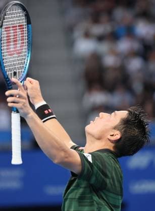 September 28, 2024, Tokyo, Japan - Kei Nishikori of Japan throws his arms in the air after he defeated Jordan Thompson of Australia at the second round match of the Japan Open Tennis championships at the Ariake Colosseum in Tokyo on Saturday, September 28, 2024. (photo by Yoshio Tsunoda AFLO) Noxthirdxpartyxsales  (0765383776st)
