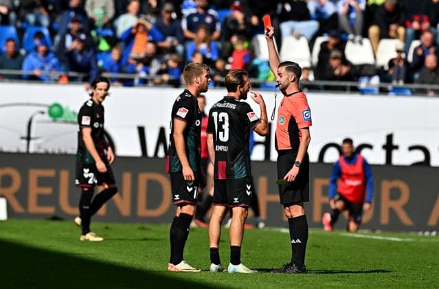 28 09 2024, xfux, Soccer 2 Bundesliga, SV Darmstadt 98 1 FC Magdeburg, v l Marcus Mathisen 1 FC Magdeburg is shown the yellow red card by referee Michael Bacher, receive a yellow red card, sending off, foul, Connor Krempicki 1 FC Magdeburg DFL DFB REGULATIONS PROHIBIT ANY USE OF PHOTOGRAPHS as IMAGE SEQUENCES and or QUASI VIDEO Licensing of the photographic work to and or by SV Darmstadt 1898 e V and subsidiaries is not permitted No release of or sale to SV Darmstadt 1898 e V Darmstadt