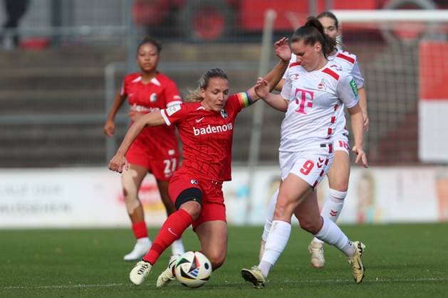 Lisa Karl SC Freiburg and Adriana Achcinska 1 FC Koeln in a duel during the Woman Bundesliga match between 1 FC Köln and SC Freiburg, Franz Kremer Stadion on September 28, 2024 in Cologne, Germany Photo by Oliver Kaelke DeFodi Images Lisa Karl SC Freiburg and Adriana Achcinska 1 FC Koeln battle for the ball during the Woman Bundesliga match between 1 FC Köln and SC Freiburg at Franz Kremer Stadion on September 28, 2024 in Köln, Germany Photo by Oliver Kaelke DeFodi Images DFL regulations prohibit any use of photographs as image sequences and or quasi video Defodi 003 678 2024 09 28 OK KOESCF 0320 Defodi-003 DFL regulations prohibit any use of photographs as image sequences and or quasi-video.