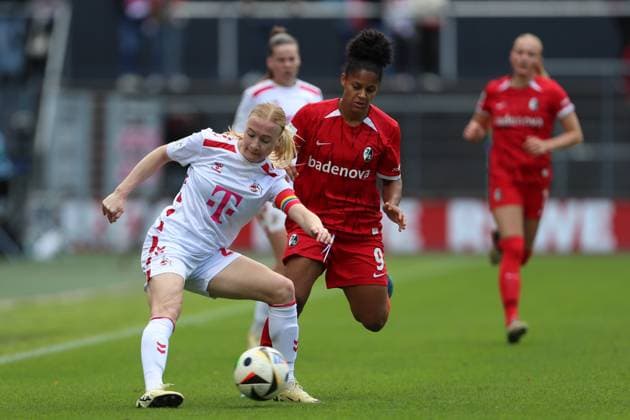 Anna Gerhardt 1 FC Koeln and Shekiera Martinez SC Freiburg in a duel during the Woman Bundesliga match between 1 FC Köln and SC Freiburg, Franz Kremer Stadion on September 28, 2024 in Cologne, Germany Photo by Oliver Kaelke DeFodi Images Anna Gerhardt 1 FC Koeln und Shekiera Martinez SC Freiburg battle for the ball during the Woman Bundesliga match between 1 FC Köln and SC Freiburg at Franz Kremer Stadion on September 28, 2024 in Köln, Germany Photo by Oliver Kaelke DeFodi Images DFL regulations prohibit any use of photographs as image sequences and or quasi video Defodi 003 678 2024 09 28 OK KOESCF 1334 Defodi-003 DFL regulations prohibit any use of photographs as image sequences and or quasi-video.