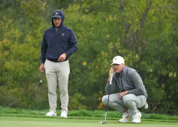 September 28, 2024, Montreal, Pq, Canada: International team member Taylor Pendrith, right, of Canada, lines up a putt on the 6th hole as United States team member Collin Morikawa looks on during their third round four-ball match at the Presidents Cup golf tournament at Royal Montreal Golf Club, in Montreal, Saturday, Sept. 28, 2024. Taylor Pendrith, Collin Morikawa - ZUMAc35_ 20240928_zaf_c35_010 Copyright: xChristinnexMuschix