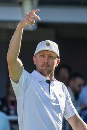 MONTREAL, QC - SEPTEMBER 28: International Team golfer Mackenzie Hughes salutes the crowd at the first tee at the 2024 Presidents Cup on September 28, 2024 at The Royal Montreal Golf Club in Montreal, QC (Photo by Vincent Ethier Icon Sportswire) GOLF: SEP 28 Presidents Cup EDITORIAL USE ONLY Icon2409280334