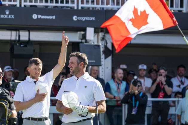MONTREAL, QC - SEPTEMBER 28: IInternational Team golfer Mackenzie Hughes and teammate Corey Conners during the Canadian national anthem at the first tee at the 2024 Presidents Cup on September 28, 2024 at The Royal Montreal Golf Club in Montreal, QC (Photo by Vincent Ethier Icon Sportswire) GOLF: SEP 28 Presidents Cup EDITORIAL USE ONLY Icon2409280580