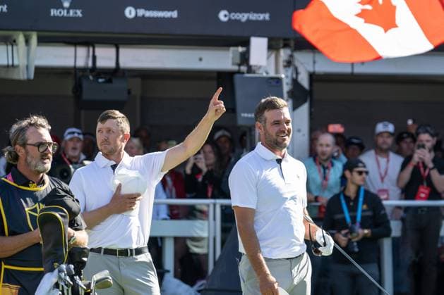 MONTREAL, QC - SEPTEMBER 28: IInternational Team golfer Mackenzie Hughes and teammate Corey Conners during the Canadian national anthem at the first tee at the 2024 Presidents Cup on September 28, 2024 at The Royal Montreal Golf Club in Montreal, QC (Photo by Vincent Ethier Icon Sportswire) GOLF: SEP 28 Presidents Cup EDITORIAL USE ONLY Icon2409280612