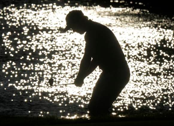 September 28, 2024, Montreal, Pq, Canada: United States team member Russell Henley is silhouetted against the water as he chips on to the 10th green during their fourth round foursomes match at the Presidents Cup golf tournament at Royal Montreal Golf Club, in Montreal, Saturday, Sept. 28, 2024. Russell Henry,  - ZUMAc35_ 20240928_zaf_c35_153 Copyright: xFrankxGunnx