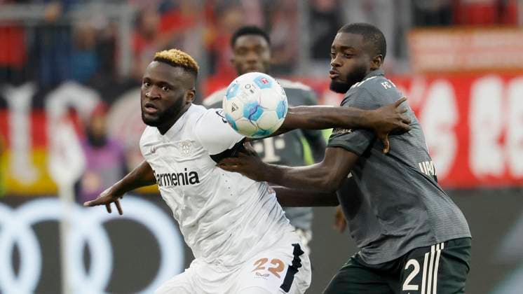In the picture from l Victor Boniface Bayer 04 Leverkusen, 22 and Dayot Upamecano FC Bayern Muenchen, 2 28 09 2024, Football, Bundesliga, FC Bayern Muenchen Bayer 04 Leverkusen, GER, Muenchen, Allianz Arena, DFL REGULATIONS PROHIBIT ANY USE OF PHOTOGRAPHS AS IMAGE SEQUENCES AND OR QUASI VIDEO Copyright: HMBxMedia xHeikoxBecker