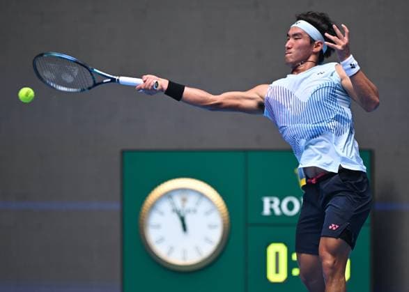 (240929) -- BEIJING, Sept. 29, 2024 -- Bu Yunchaokete hits a return during the men s singles second round match between Bu Yunchaokete of China and Lorenzo Musetti of Italy at 2024 China Open tennis tournament in Beijing, capital of China, Sept. 29, 2024. ) (SP)CHINA-BEIJING-TENNIS-CHINA OPEN-MEN S SINGLES (CN) ZhangxLong 