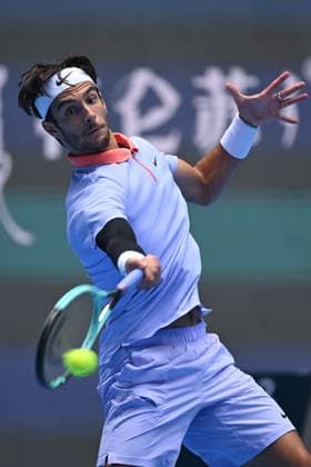 (240929) -- BEIJING, Sept. 29, 2024 -- Lorenzo Musetti hits a return during the men s singles second round match between Bu Yunchaokete of China and Lorenzo Musetti of Italy at 2024 China Open tennis tournament in Beijing, capital of China, Sept. 29, 2024. ) (SP)CHINA-BEIJING-TENNIS-CHINA OPEN-MEN S SINGLES (CN) ZhangxLong 