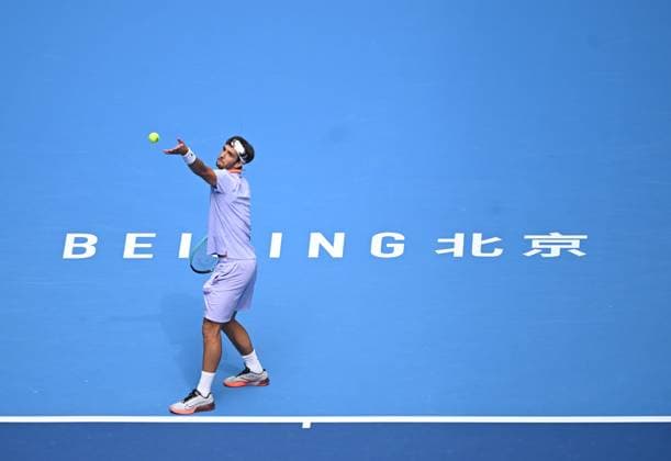 (240929) -- BEIJING, Sept. 29, 2024 -- Lorenzo Musetti serves during the men s singles second round match between Bu Yunchaokete of China and Lorenzo Musetti of Italy at 2024 China Open tennis tournament in Beijing, capital of China, Sept. 29, 2024. ) (SP)CHINA-BEIJING-TENNIS-CHINA OPEN-MEN S SINGLES (CN) ZhangxLong 