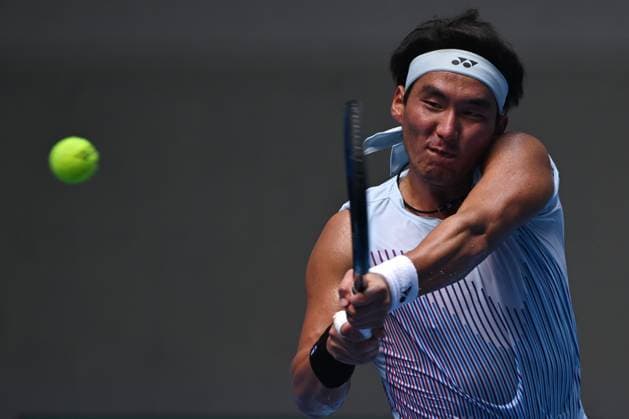 (240929) -- BEIJING, Sept. 29, 2024 -- Bu Yunchaokete hits a return during the men s singles second round match between Bu Yunchaokete of China and Lorenzo Musetti of Italy at 2024 China Open tennis tournament in Beijing, capital of China, Sept. 29, 2024. ) (SP)CHINA-BEIJING-TENNIS-CHINA OPEN-MEN S SINGLES (CN) ZhangxLong 