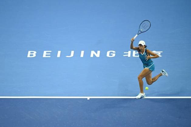 (240929) -- BEIJING, Sept. 29, 2024 -- Zhang Shuai hits a return during the women s singles third round match between Zhang Shuai of China and Greet Minnen of Belgium at 2024 China Open tennis tournament in Beijing, capital of China, Sept. 29, 2024. ) (SP)CHINA-BEIJING-TENNIS-CHINA OPEN-WOMEN S SINGLES (CN) ZhangxLong 
